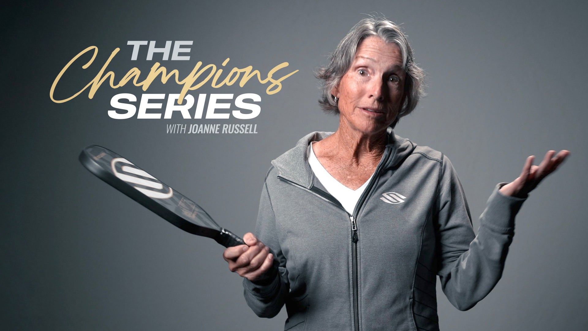 JoAnne Russell presenting The Champions Series pickleball lessons with a paddle