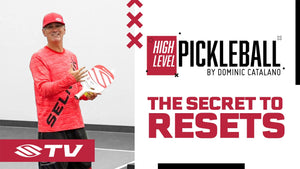 Dominic Catalano holding a pickleball paddle, promoting 'The Secret to Resets' in pickleball.