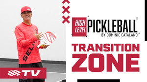 A player demonstrating pickleball techniques in the transition zone with a paddle and ball.