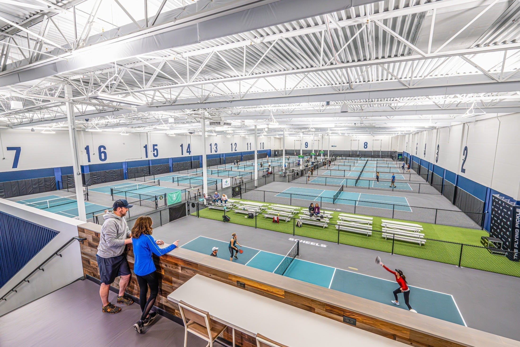 View of indoor pickleball courts at The Flying Pickle in Meridian, Idaho, with players in action.