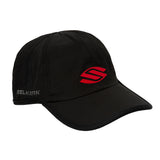 Front view of a black baseball cap with a red Selkirk logo.