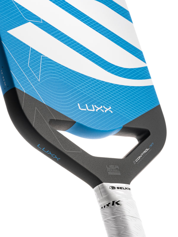 Selkirk LUXX Control Air Pickleball Paddle with InfiniGrit in the Invikta paddle shape. In blue, red, and purple.
