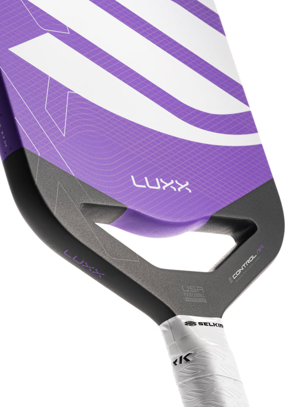 Selkirk LUXX Control Air Pickleball Paddle with InfiniGrit in the Invikta paddle shape. In blue, red, and purple.