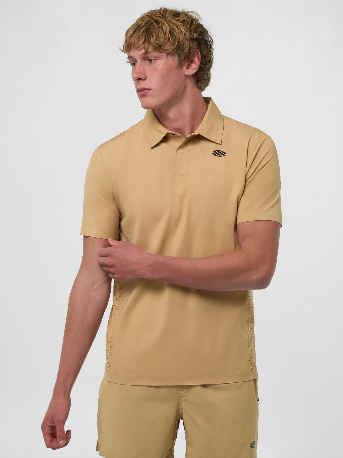 Model wearing Sandstorm Men's Pro Line Performance Polo in beige