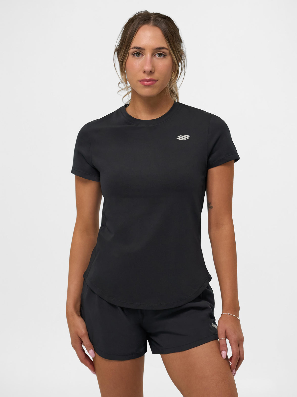 Model wearing a Selkirk pickleball Blackout Women's Pro Line Short Sleeve Training Tee.