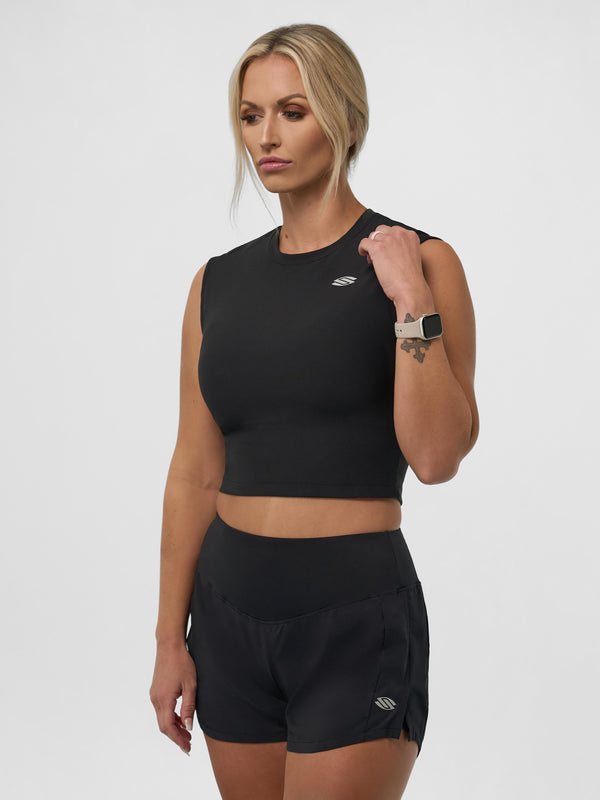 Selkirk pickleball Blackout Women's Pro Line Cap Sleeve Fitted Tee in black, model wearing shorts.