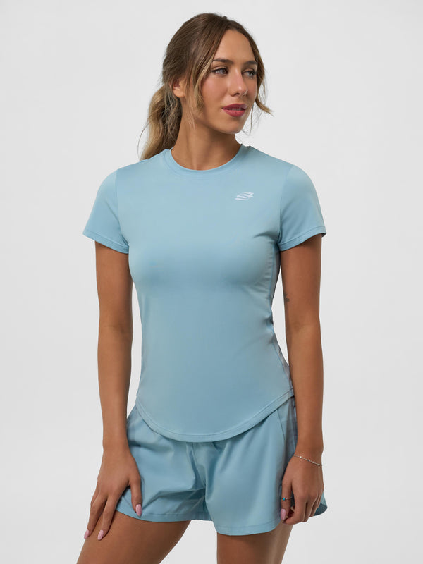 Selkirk pickleball Light blue Women's Pro Line Short Sleeve Training Tee worn with matching shorts.