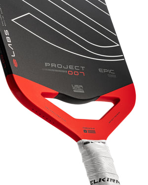Selkirk LABS Project 007 14mm Epic pickleball paddle with red handle and black face.