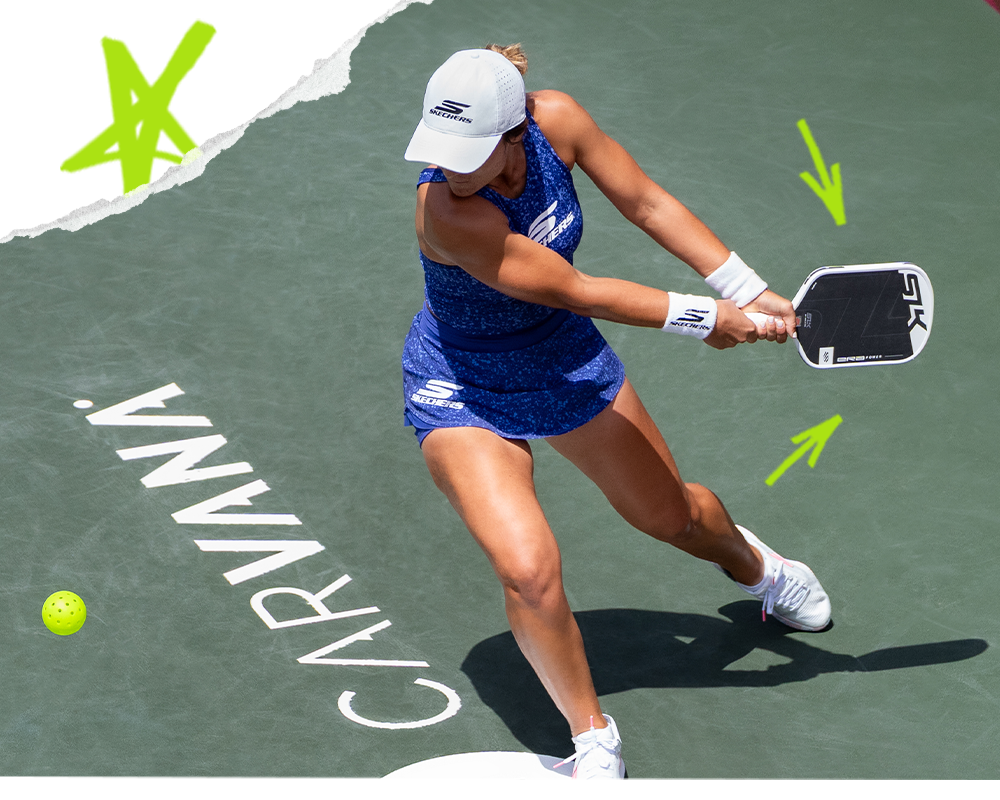 Catherine Parenteau playing pickleball with an SLK Era White paddle, mid-swing on a green court.