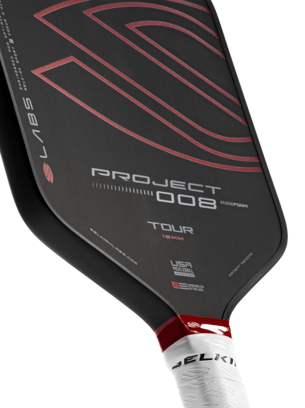 Selkirk LABS Project 008 16mm Tour pickleball paddle with black and red design.