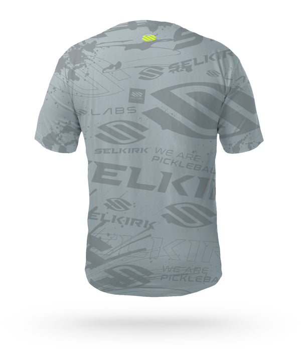 Crafted for Selkirk Sport pickleball athletes and fans, introducing the Selkirk Emblem Men's Short Sleeve pickleball shirt with Selkirk's Stretch-Wik Technology, in gray, blue, and green, for pickleball players.