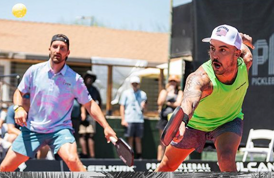 Tyson McGuffin and Ben Newell competing in the Selkirk LABS Showdown, with McGuffin in a green shirt and Newell in a patterned shirt.