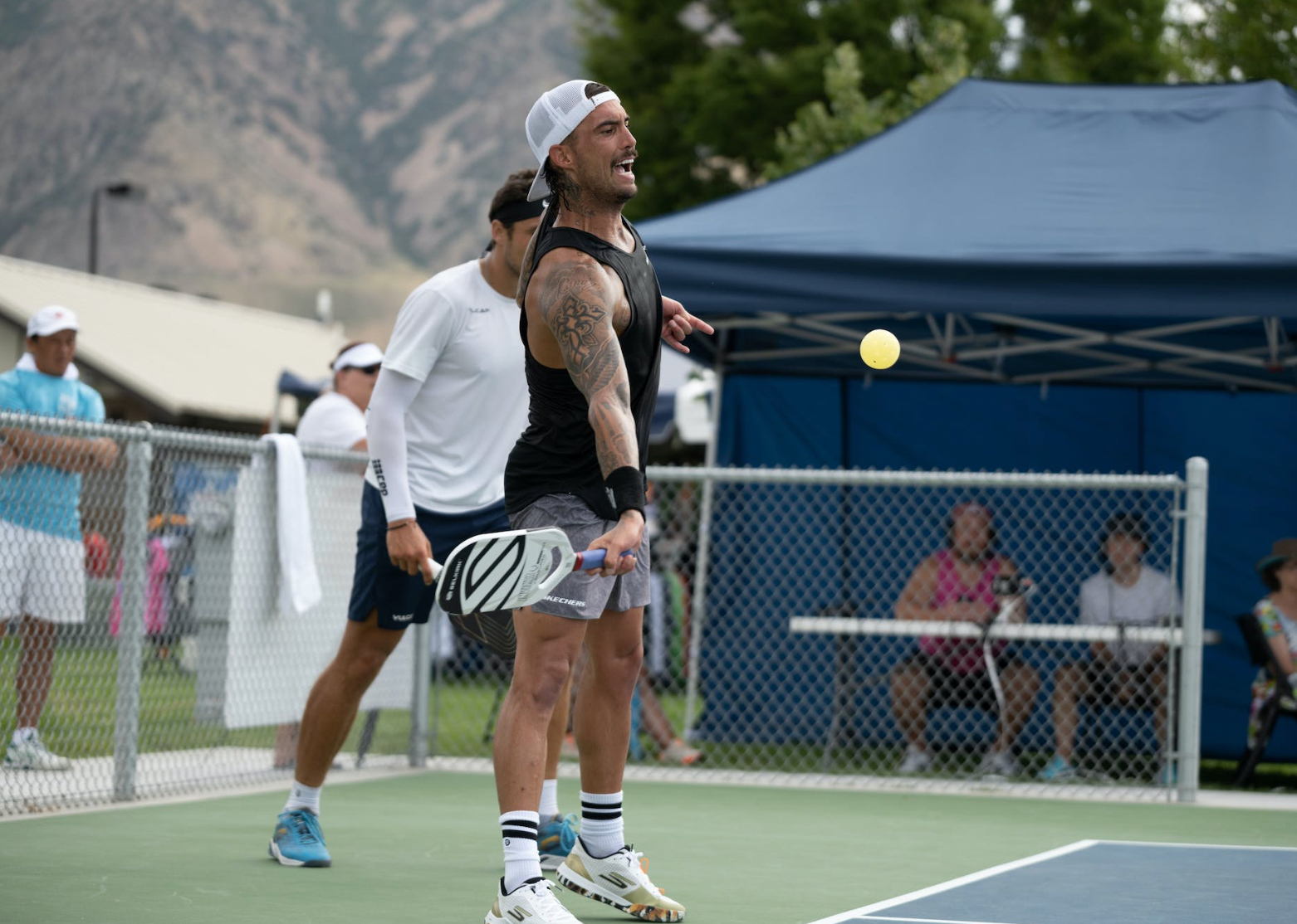 A player preparing to hit a pickleball during a match at the Baird Wealth Management Open.
