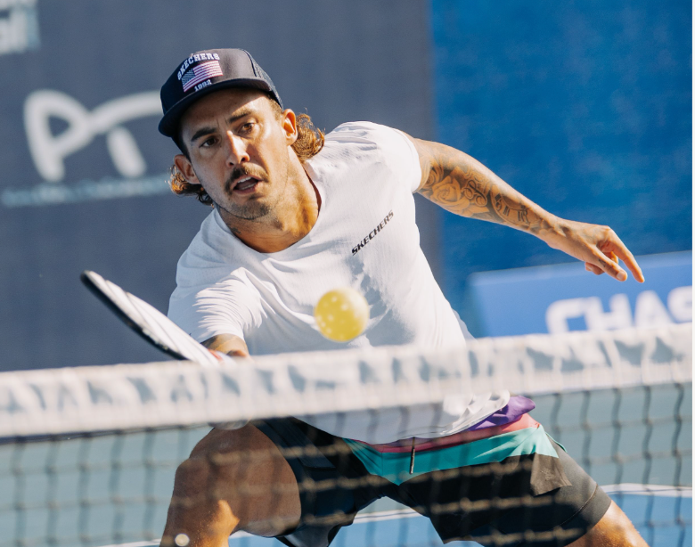 Tyson McGuffin lunging to hit a pickleball during a match at the PPA Baird Wealth Management Open.