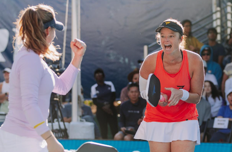 Andrea Koop celebrating with a teammate after winning a match at the PPA Takeya Showcase.