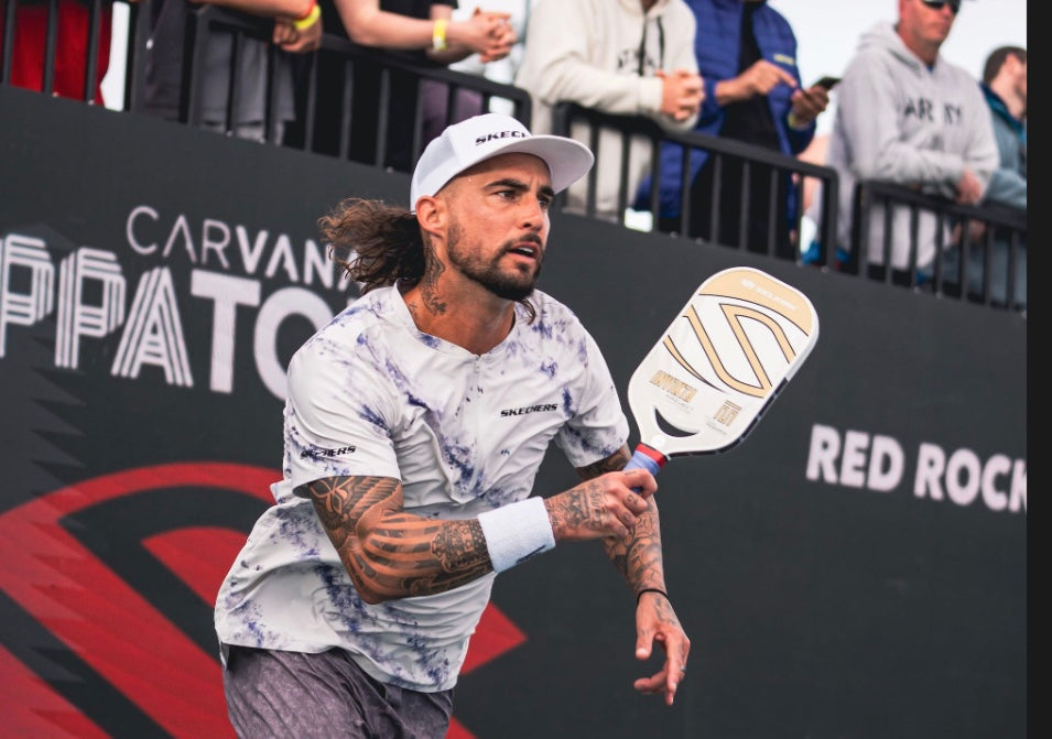Player preparing to hit a pickleball with a paddle at the Selkirk Red Rock Open