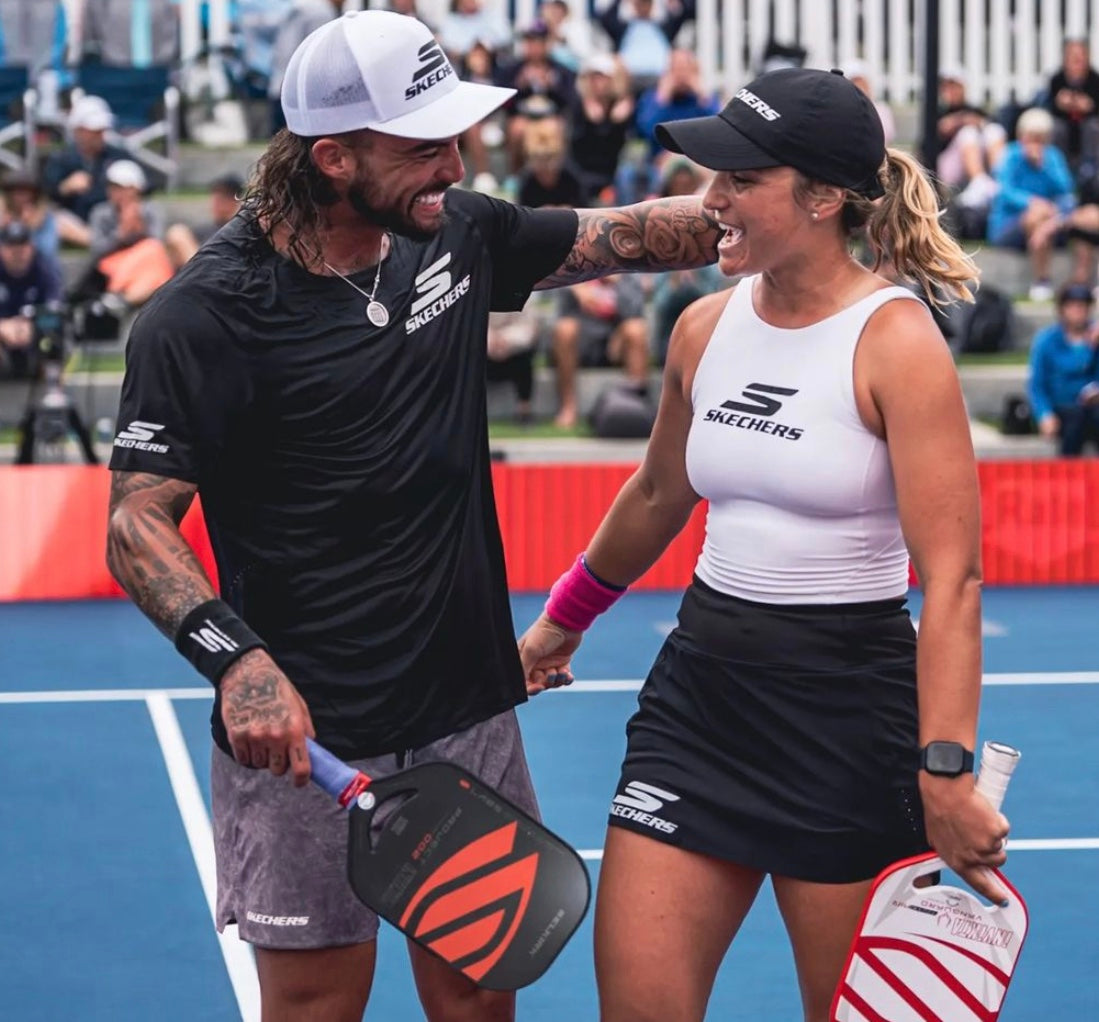 Catherine Parenteau and Tyson McGuffin celebrating on the court after a match.