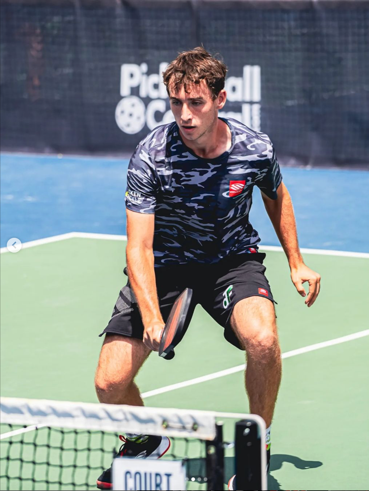 Player preparing to hit a pickleball shot during a match at the PPA Denver Open.