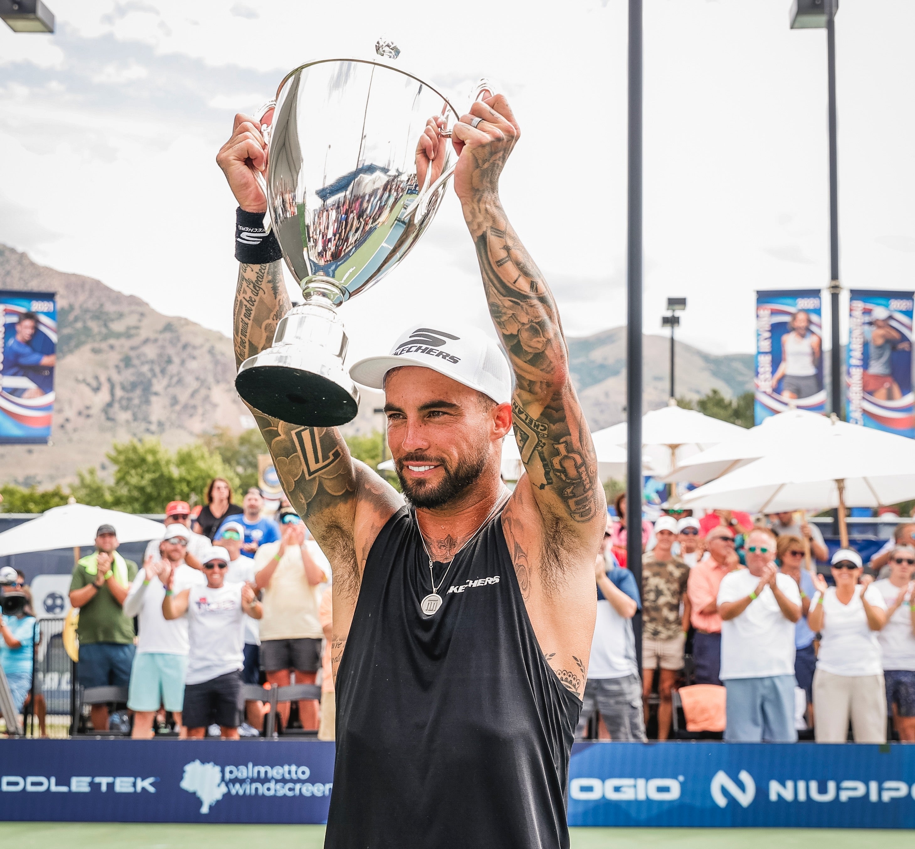 Tyson McGuffin celebrating with the trophy after winning his first Triple Crown at the 2023 PPA Tournament of Champions.
