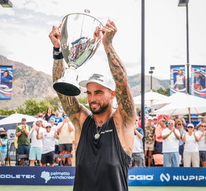 Tyson McGuffin celebrating with the trophy after winning his first Triple Crown at the 2023 PPA Tournament of Champions.