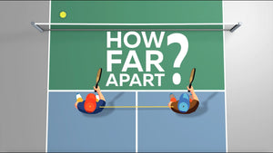 Top view of two players on a pickleball court with the text 'HOW FAR APART?' and a yellow ball above them.