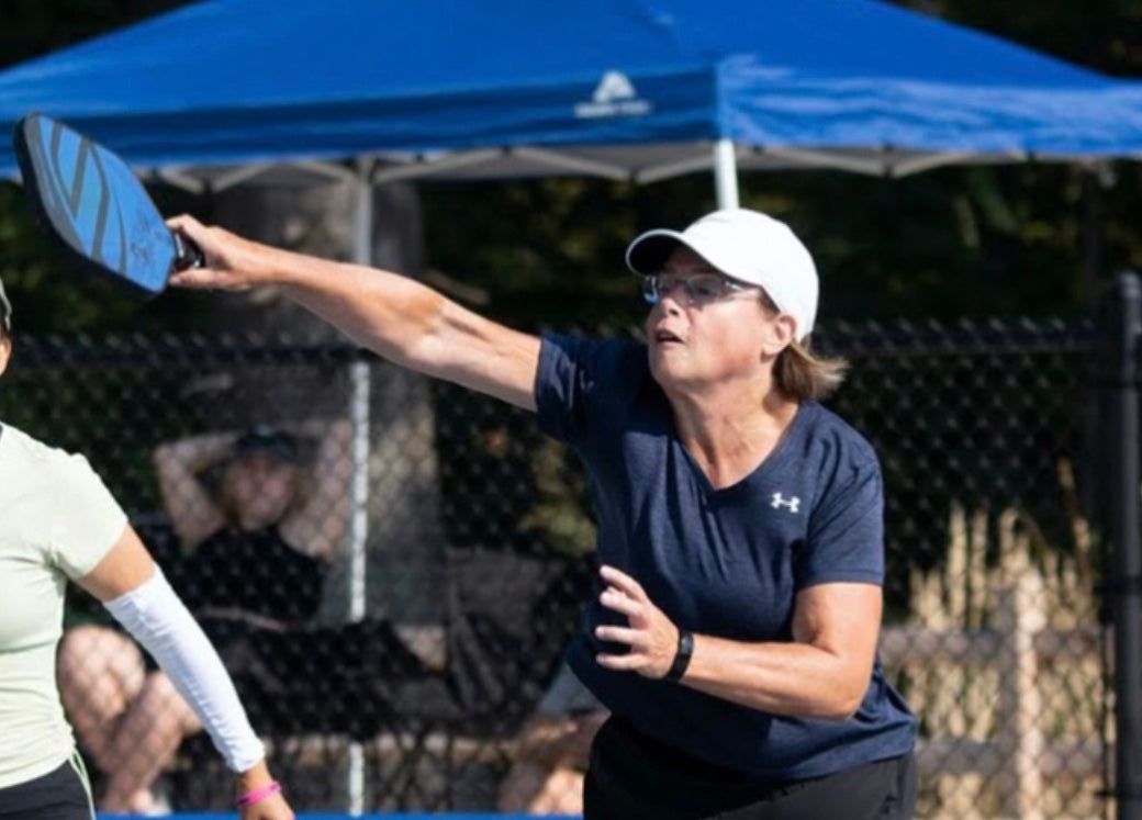 Maggie Murch playing pickleball, demonstrating her competitive spirit.