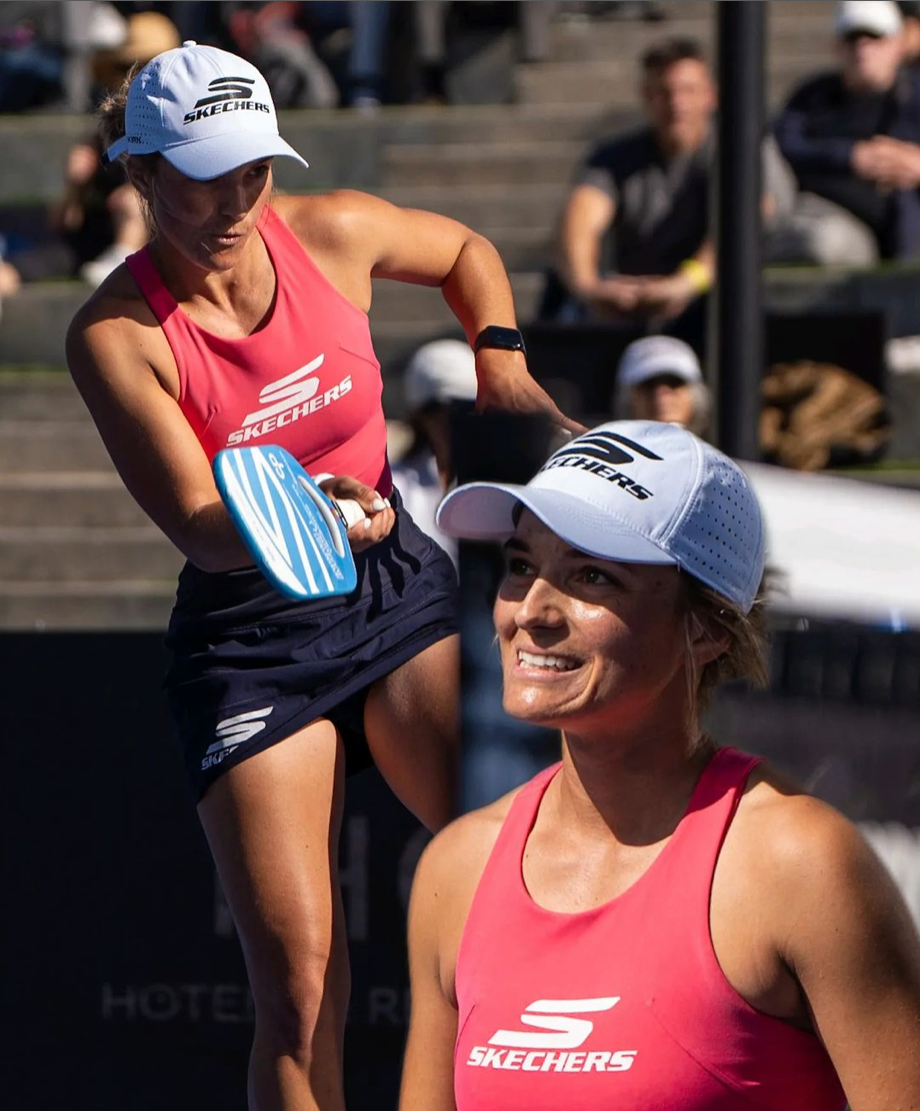 Anna Leigh Waters preparing to serve during a pickleball match, wearing Skechers gear.