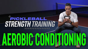 A man performing kettlebell swings for aerobic conditioning on a pickleball court