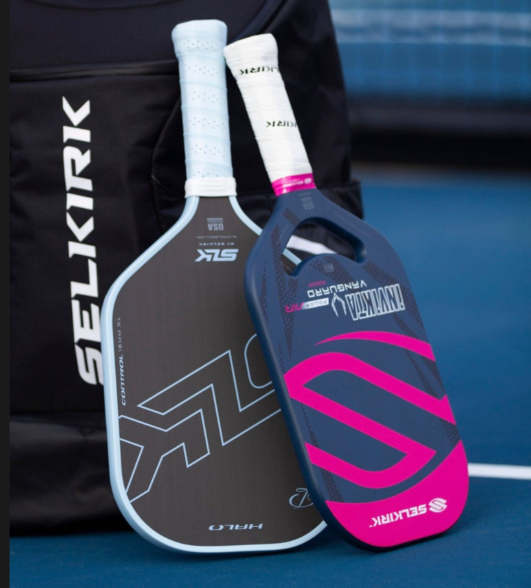 Two Selkirk pickleball paddles: SLK Halo and Vanguard Power Air, displayed against a bag.