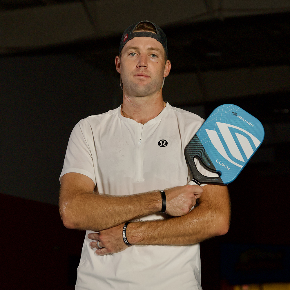 Jack Sock holding the Luxx Control Air paddle, preparing for his PPA Masters debut.