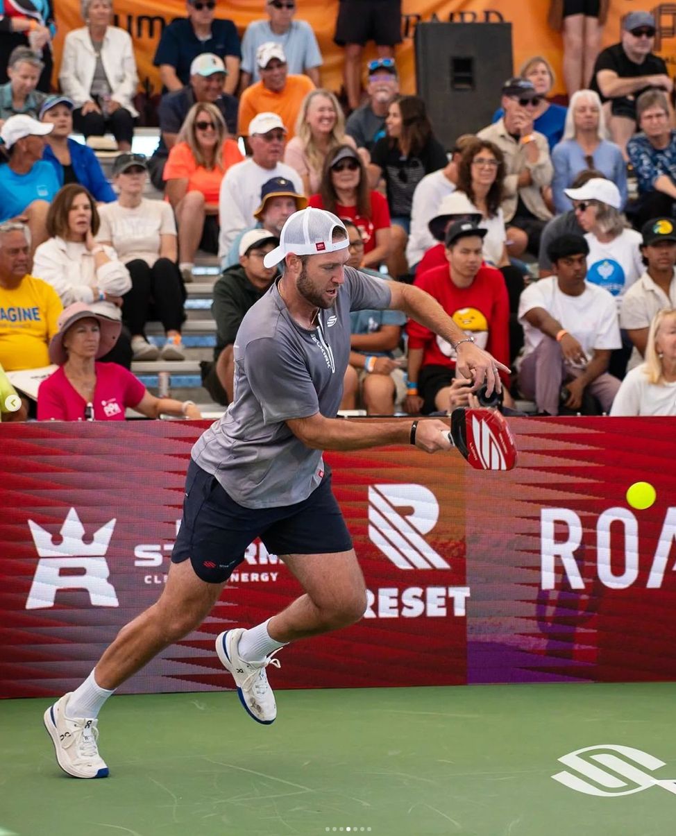 Ben Johns hitting a pickleball shot during the Skechers Invitational, with logos for Skechers and Reset visible.