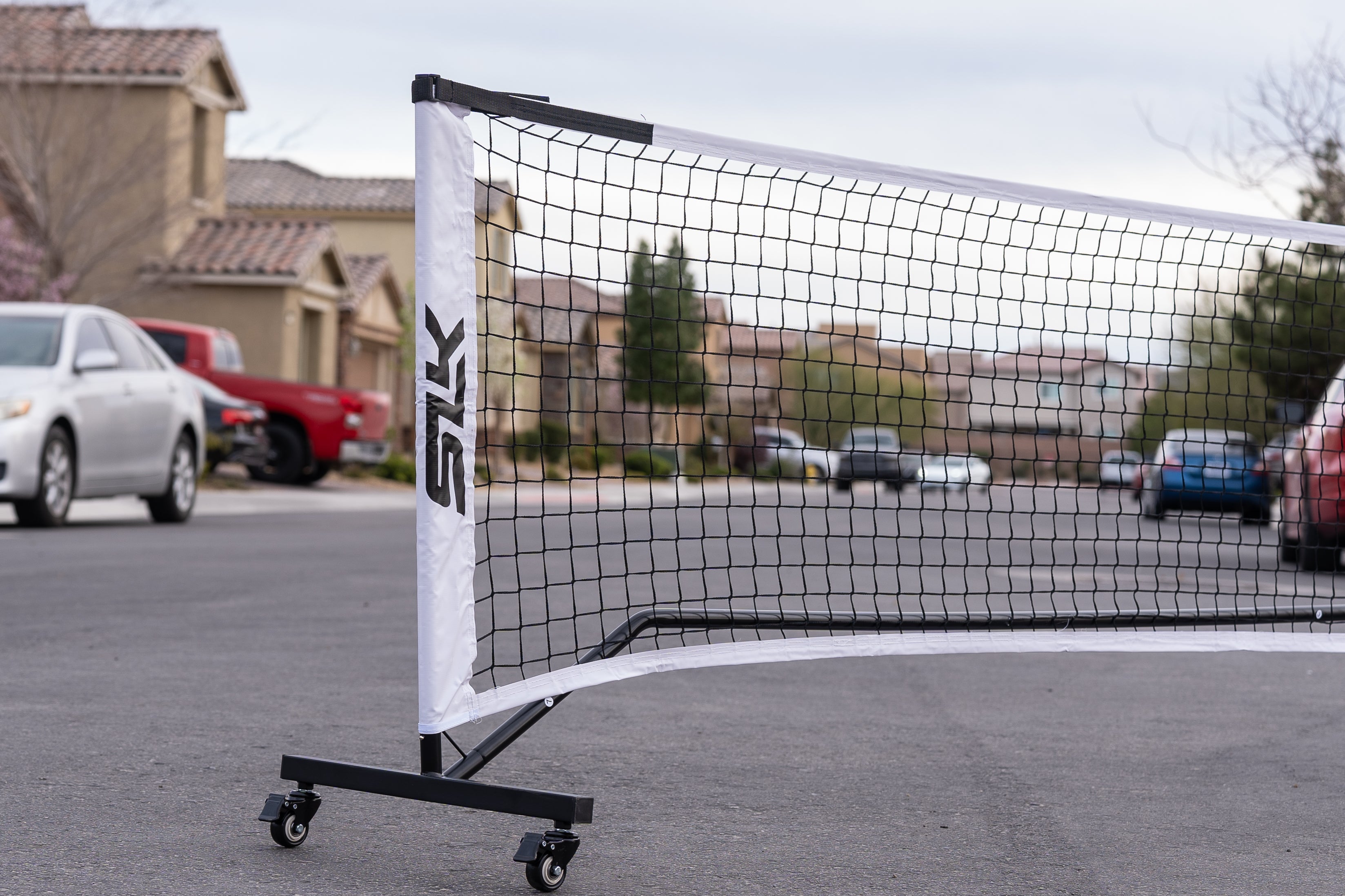 Portable pickleball net on a street