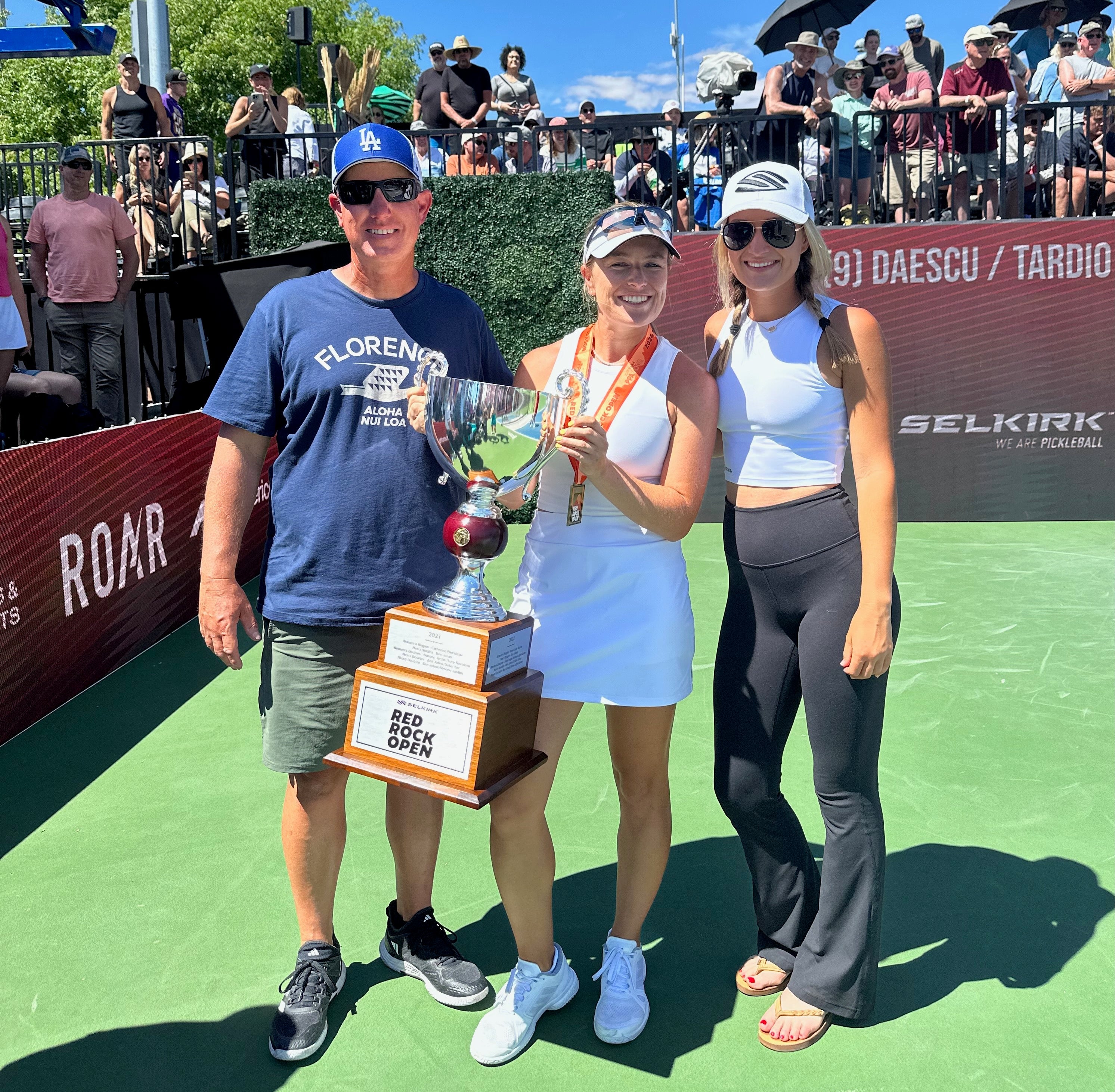 Mary and Vinnie Brascia with a trophy, celebrating a pickleball victory