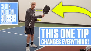 Senior pickleball player demonstrating a tip with paddle and ball, text: 'THIS ONE TIP CHANGES EVERYTHING!'