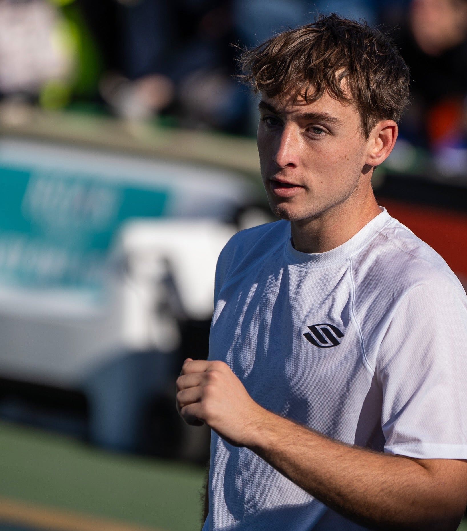 Dylan Frazier pumping his fist on a pickleball court