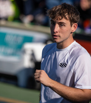 Dylan Frazier pumping his fist on a pickleball court