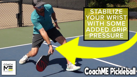 Morgan Evans in a low defensive position on a pickleball court, with text: 'STABILIZE YOUR WRIST WITH SOME ADDED GRIP PRESSURE.'