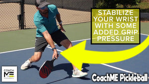 Morgan Evans in a low defensive position on a pickleball court, with text: 'STABILIZE YOUR WRIST WITH SOME ADDED GRIP PRESSURE.'