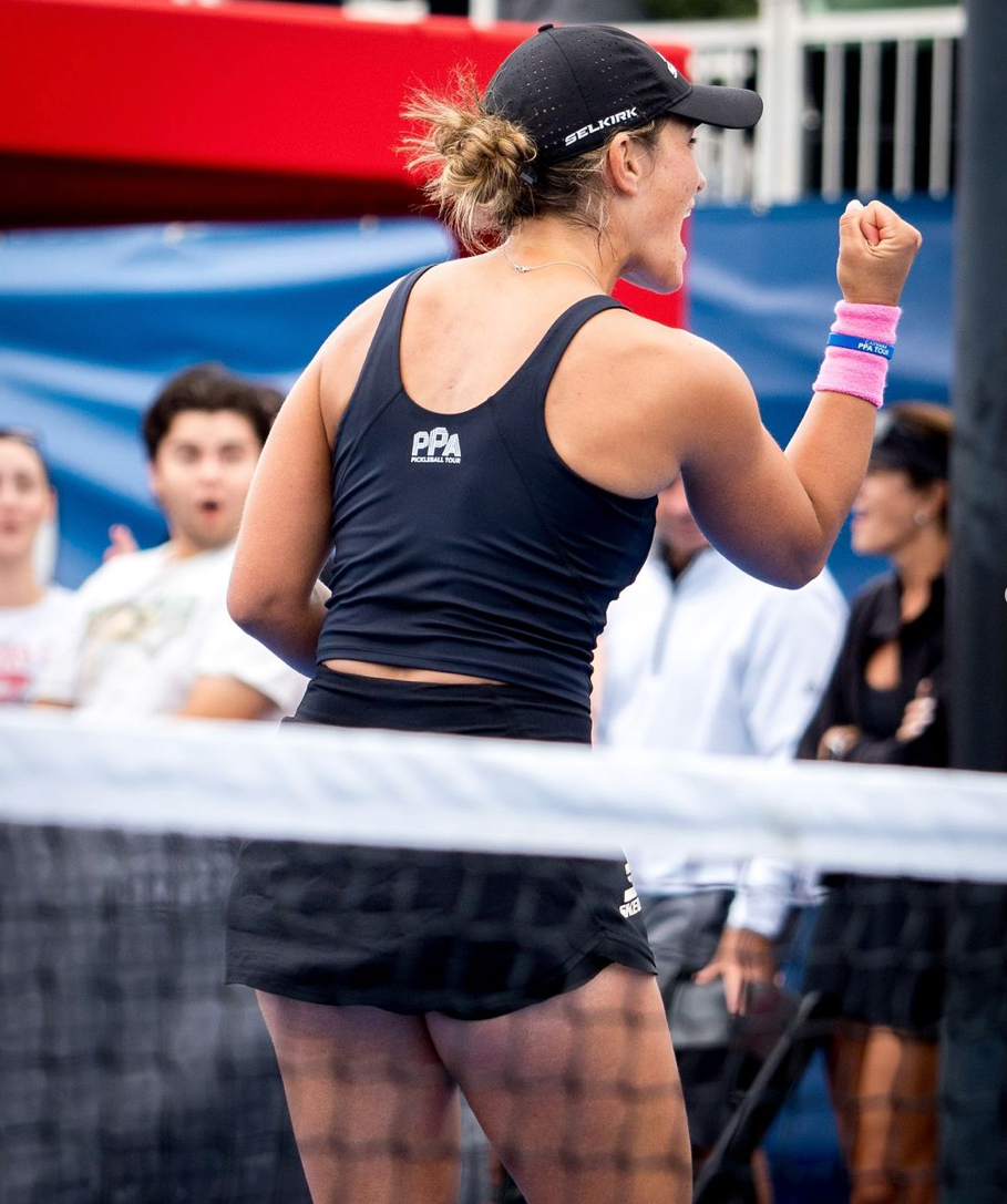 A player celebrating a point during a mixed doubles match in Kansas City