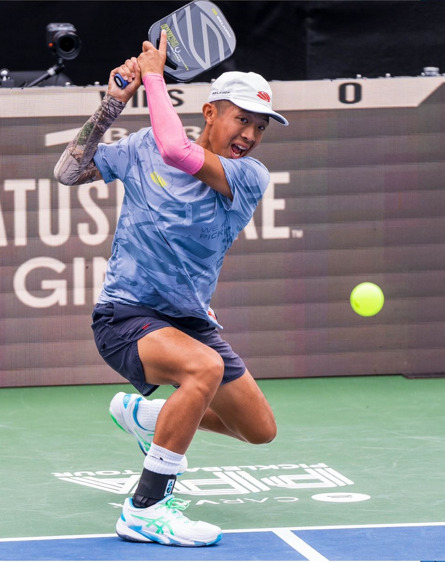 Player hitting a pickleball during a match at the PPA Virginia Beach Cup