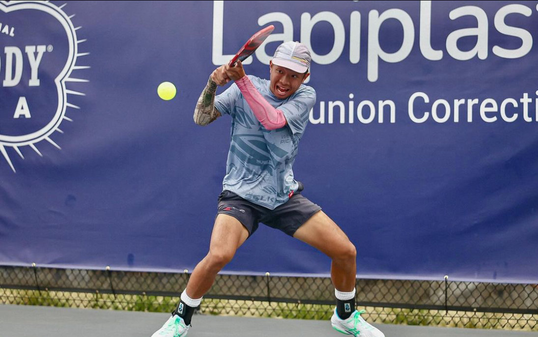 Quang Duong hitting a forehand during a match at Brookehaven Country Club