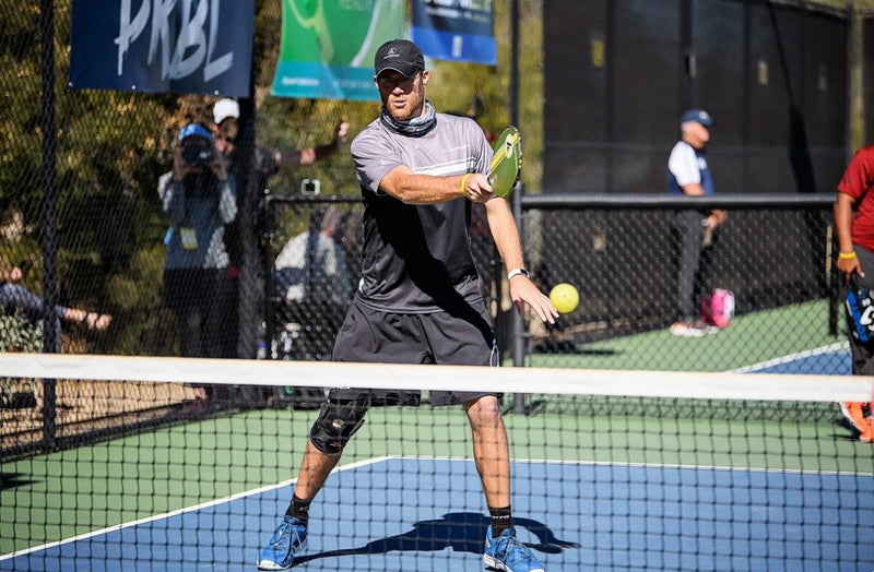 Ben Paquette hits a volley on an Invited Club pickleball court in Dallas, Texas. 