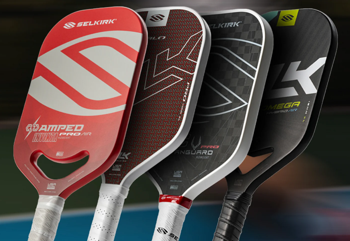 Lineup of Selkirk hybrid paddles: AMPED Pro Air, SLK HALO, Vanguard, and Omega, showcasing various designs and textures.