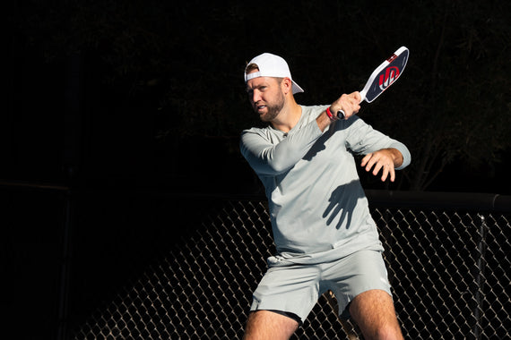 Jack Sock hits a forehand with the Jack Sock signature paddle