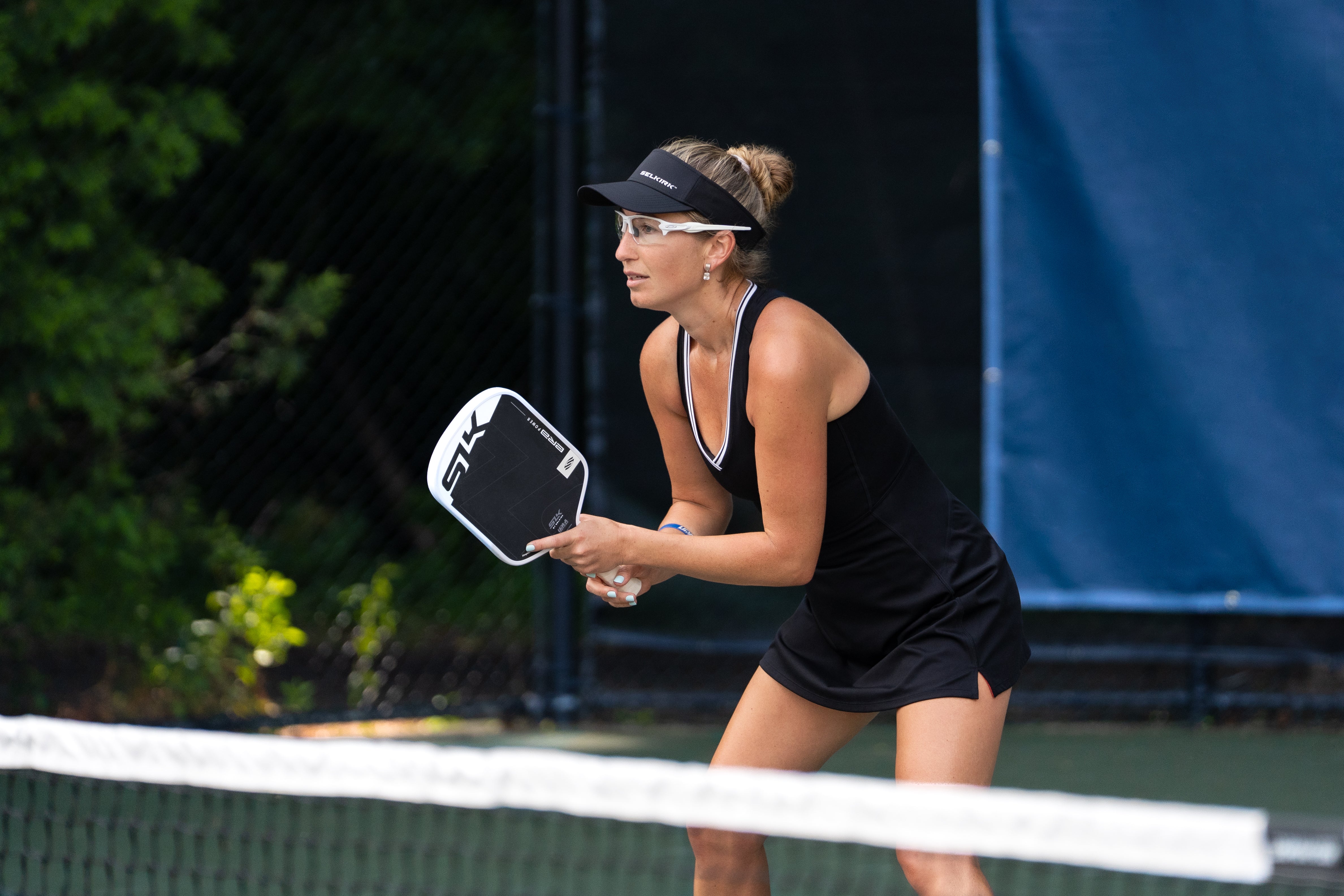 Selkirk pro Lauren Stratman prepares to hit a volley shot with her SLK ERA Power paddle. 