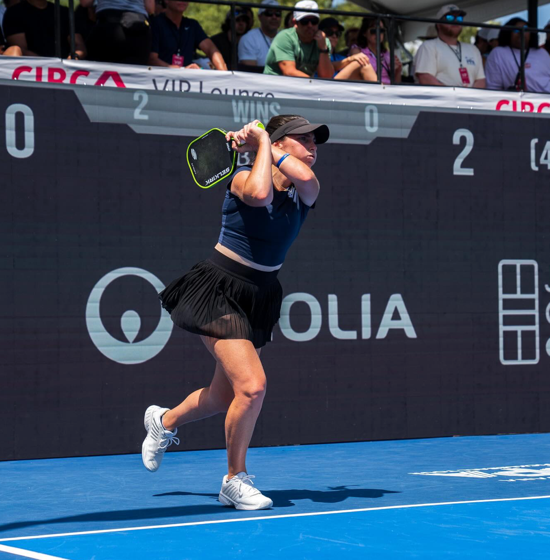 Pickleball pro Rachel Rohrabacher hitting a backhand shot during a match at the Veolia Houston Open.