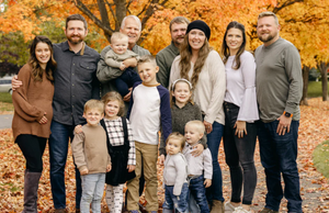 Selkirk Sport founders the Barnes family, posing outdoors in autumn, surrounded by colorful leaves.