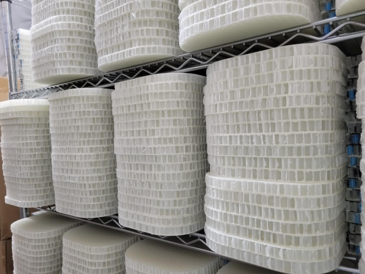 A stack of carbon fiber paddles sit on a rack at the Selkirk warehouse. 