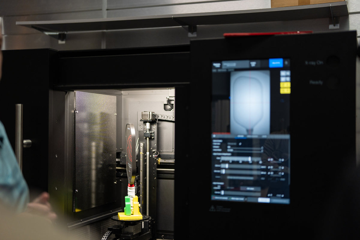 A CT scanner is used to scan a Selkirk paddle inside Selkirk Labs. 