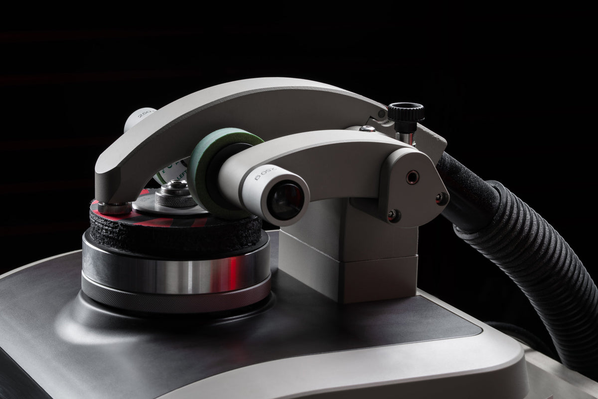 A taber abrasion machine tests samples of paddles for grit durability. 